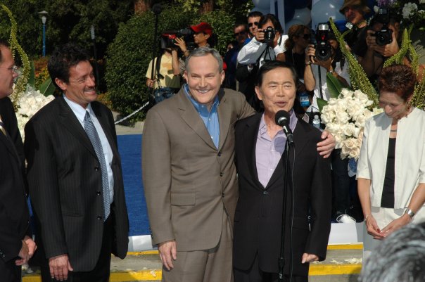 George Takei and Brad Altman at West Hollywood Park in June 2008 with City Councilmember John Duran on left.