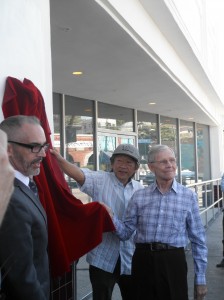 A plaque acknowledging the Black Cat's role in LGBT history was unveiled Tuesday  by LA Councilmember Mitch O'Farrell, left; Wes Joe of the Friends of the Black Cat, center, and Alexei Romanoff, right, who was present at the 1967 protest.