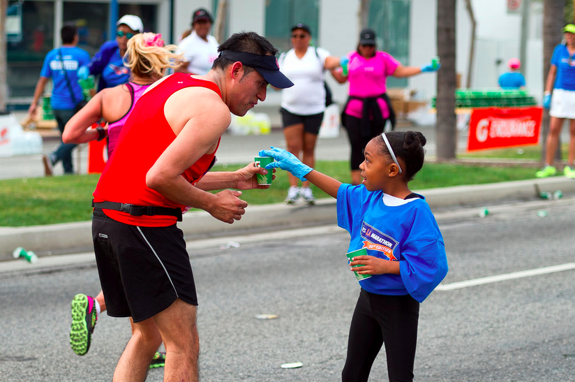 A marathon runner is always grateful for a little water. (Photo: Jon Viscott)