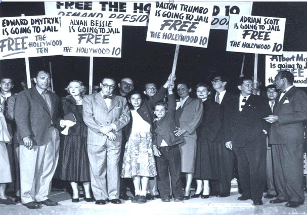 The “Hollywood Ten” – screenwriters who refused to answer questions by the House Un-American Activities Committee – staged a demonstration at Los Angeles Airport with families and attorneys as they left to serve prison sentences of up to one year in 1950. Five of the 10 were West Hollywood residents. From left: Lester Cole, Dalton Trumbo, Alvah Bessie, Nicole Trumbo, Christopher Trumbo, Cleo Trumbo, Mrs. Ring Lardner, Jr., Ring Lardner, Jr., Ben Margolis (attorney for the 10), and Herbert Biberman. (Photo courtesy of the Los Angeles County Public Library Photo Collection).