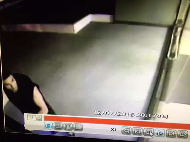 A man preparing to steal mail on Dec. 7 from mailboxes at 906 Doheny Dr. (Image from building video)