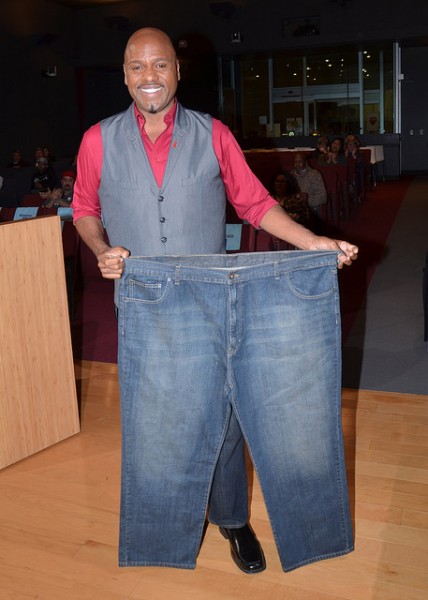 Papa Joe Aviance at Monday's City Council meeting in his size 36 jeans and showing off his old size 56 jeans (Photo by Richard Settle, courtesy City of West Hollywood)