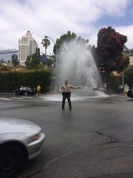 Water shooting from a fire hydrant at the corner of Sweetzer and Fountain avenues this morning (Photo ANG NEWS)