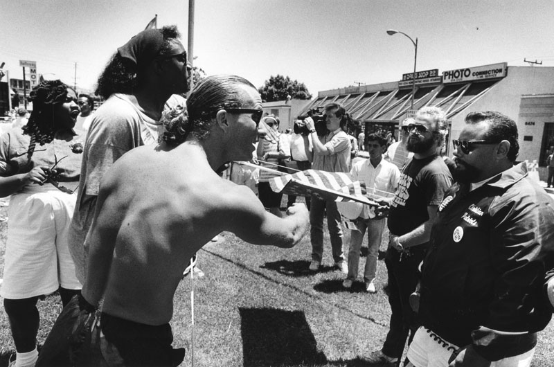 Those with different views clashed at the Gay Parade and Festival June 25, 1989 in West Hollywood. Photo shows gay rights supporters clashing with Rueben Israel, right, organizer of Christian Brothers, who shouted, "Go back to the closet." (Los Angeles Herald Examiner Collection, Los Angeles Public Library Photo Collection)