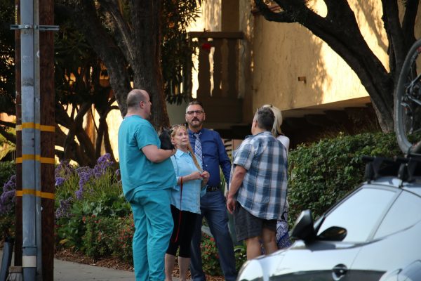 Residents wait outside 840 Larrabee St. in West Hollywood as deputies investigate a bomb report. (Photo by Jim Garrecht / ANG News)