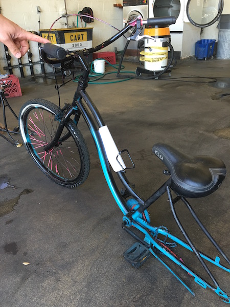 What appears to be a woman's bike that was in the process of being repainted when it was recovered. Note the pink spokes and bit of pink, likely original, on the handlebar.