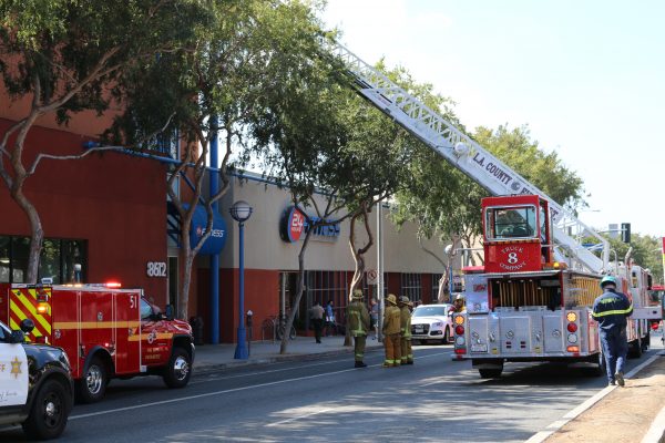 Firefighters responding to an air conditioner fire at WeHo's 24 Hour Fitness. (Photo by Jim Garrecht / ANG News)